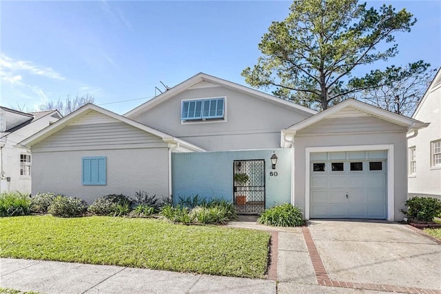 view of front of home with a garage and a front yard