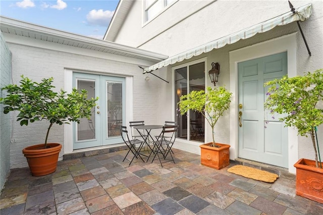 doorway to property with a patio and french doors