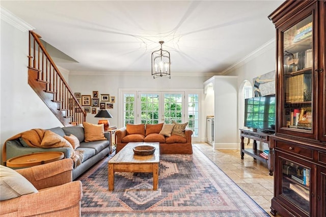 living room featuring a notable chandelier and crown molding