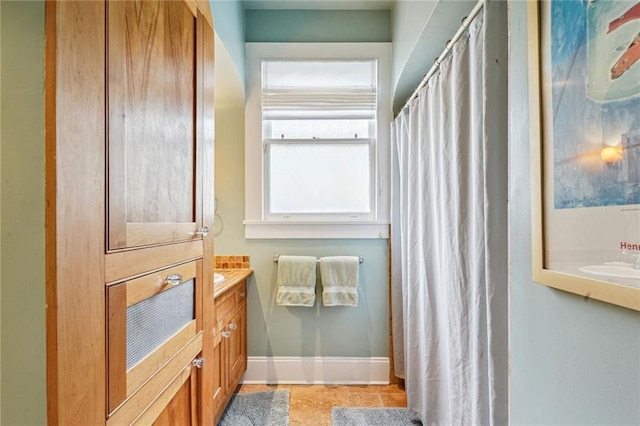 bathroom with tile patterned flooring and vanity