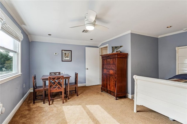 carpeted bedroom with crown molding and ceiling fan