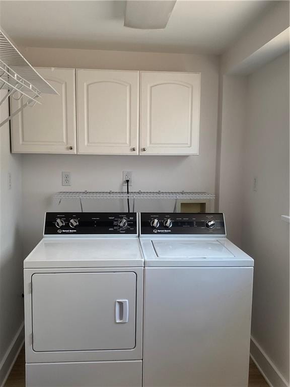 laundry area with cabinets and washer and dryer