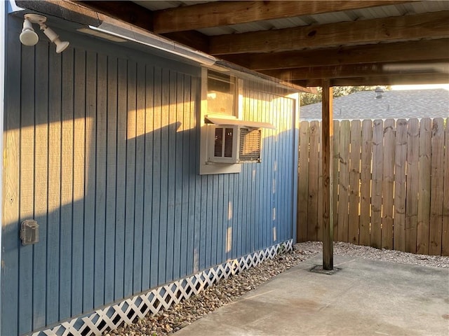 view of side of property with a patio