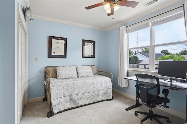 bedroom with crown molding, light colored carpet, a closet, and ceiling fan