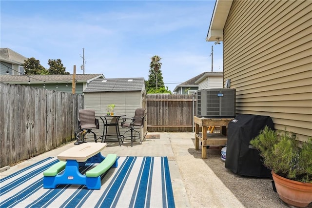 view of patio with central AC and area for grilling