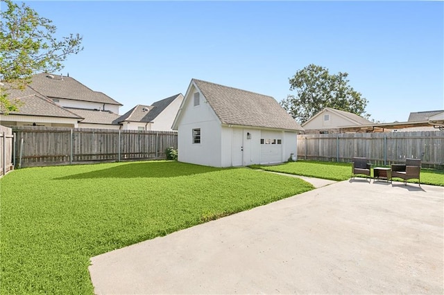 view of yard featuring an outbuilding and a patio area