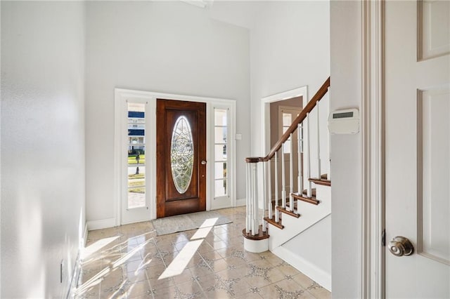 foyer entrance with a high ceiling