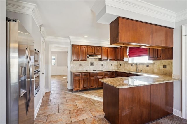 kitchen featuring appliances with stainless steel finishes, sink, kitchen peninsula, crown molding, and light stone countertops