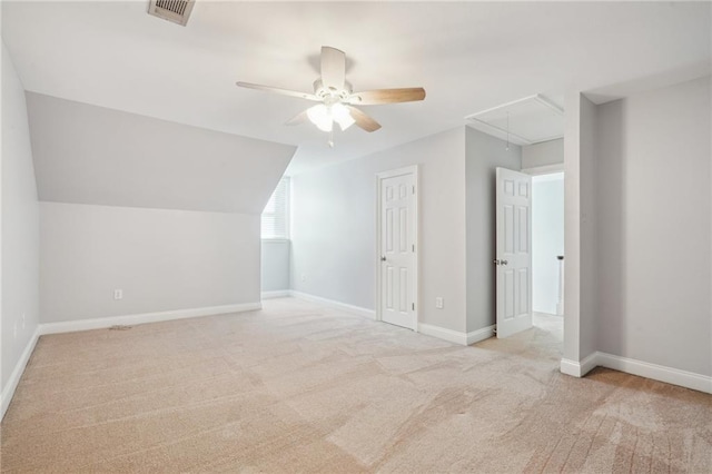 bonus room with ceiling fan, lofted ceiling, and light carpet