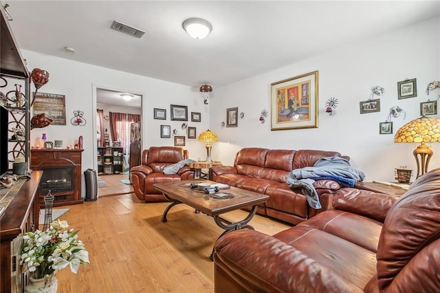 living room with light hardwood / wood-style floors