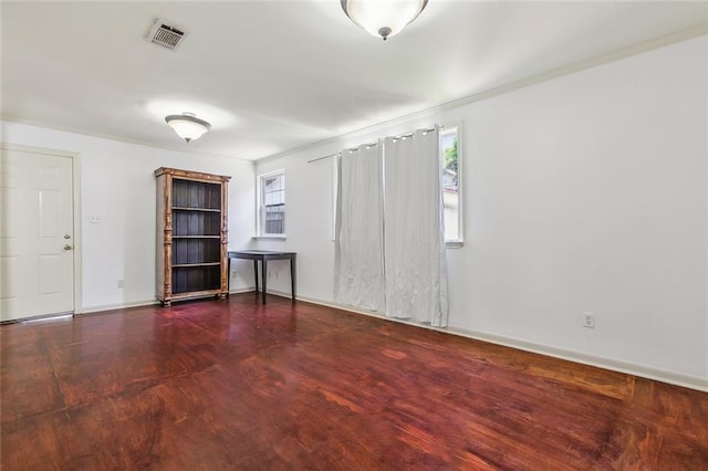 spare room with dark wood-type flooring