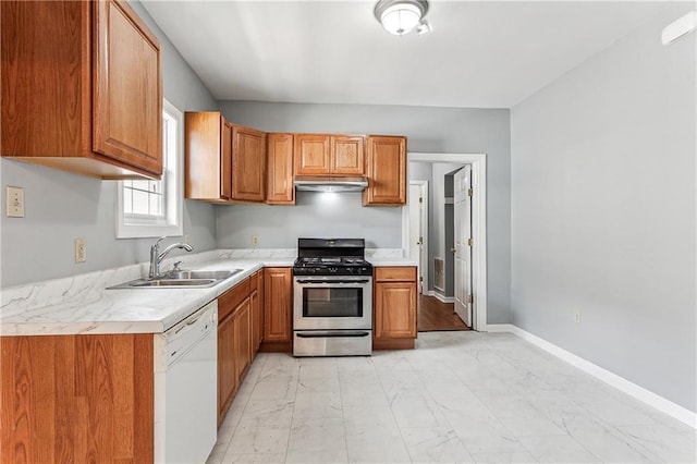 kitchen featuring sink, stainless steel gas range oven, and dishwasher