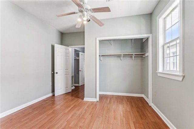 unfurnished bedroom featuring light hardwood / wood-style flooring, a closet, and ceiling fan