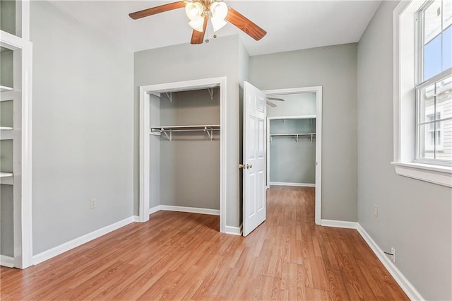 unfurnished bedroom with light hardwood / wood-style floors and ceiling fan