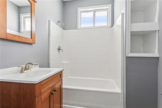 bathroom with vanity and bathing tub / shower combination