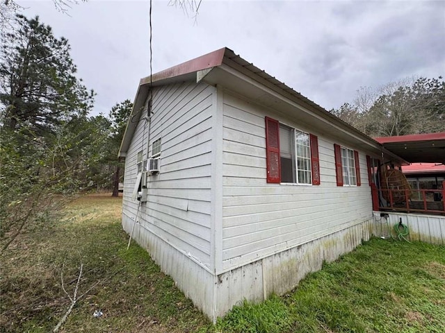 view of side of home featuring a yard