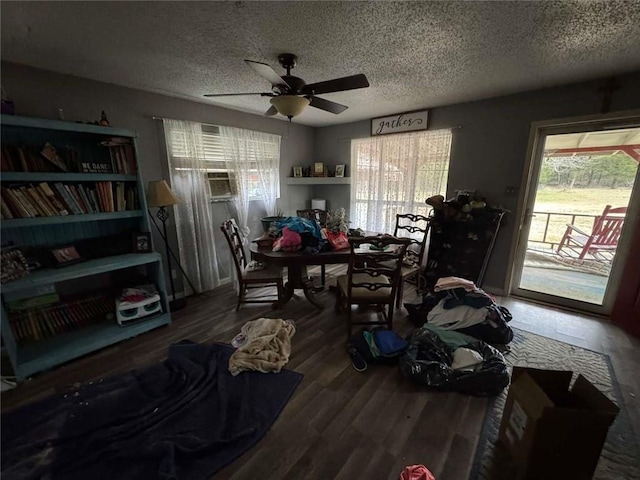 interior space featuring ceiling fan, a textured ceiling, a wealth of natural light, and wood-type flooring