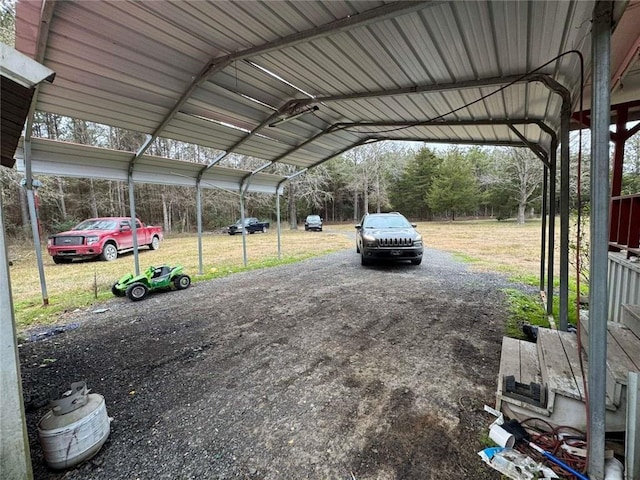 view of vehicle parking featuring a carport and a yard