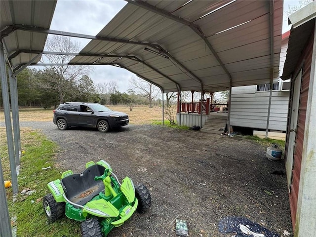 view of vehicle parking with a carport