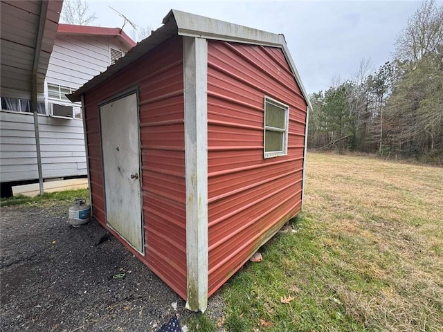 view of outbuilding with a lawn