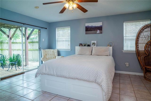 bedroom with ceiling fan, light tile patterned floors, and access to outside