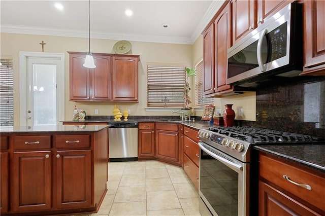 kitchen featuring pendant lighting, crown molding, stainless steel appliances, and light tile patterned flooring