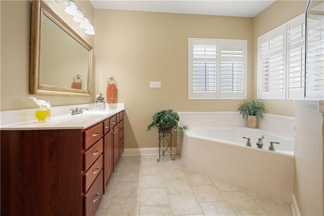 bathroom with vanity, a tub, and tile patterned floors