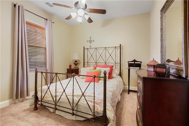 bedroom with light colored carpet and ceiling fan