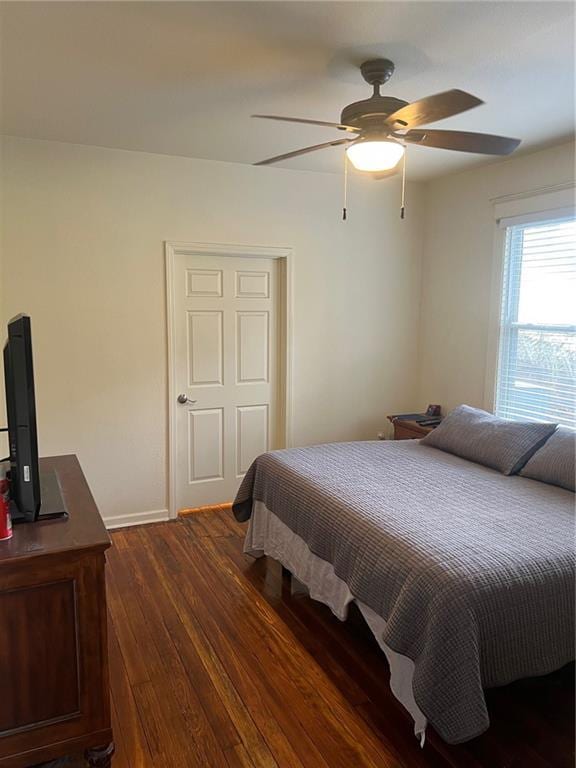 bedroom featuring dark hardwood / wood-style flooring and ceiling fan