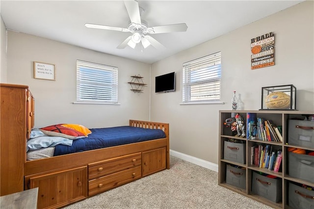 bedroom with light colored carpet and ceiling fan