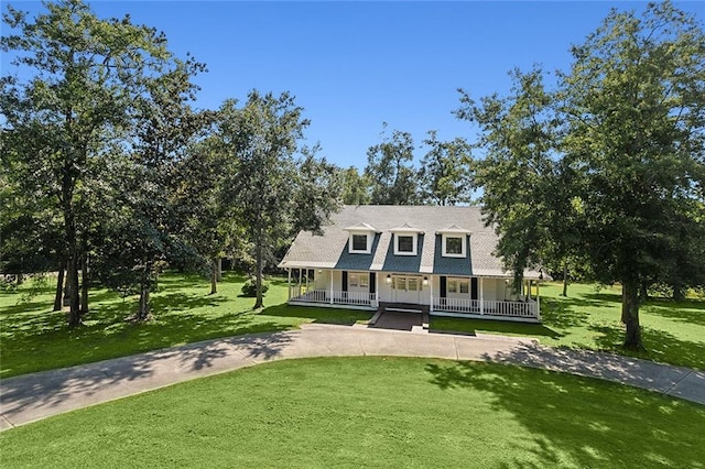 view of front of home featuring covered porch and a front yard