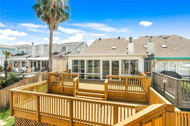 deck with a sunroom