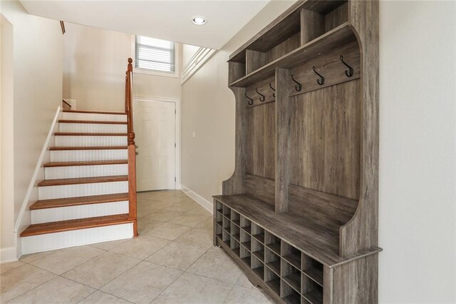 mudroom with light tile patterned floors