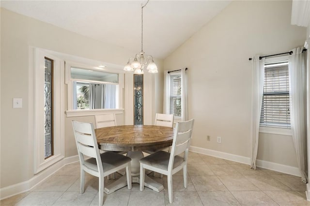 dining area with vaulted ceiling, a wealth of natural light, and light tile patterned floors