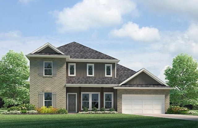 view of front of house with a garage and a front lawn