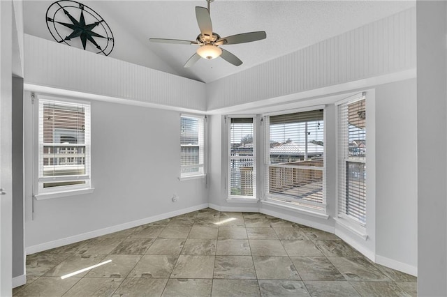 unfurnished room with lofted ceiling and ceiling fan