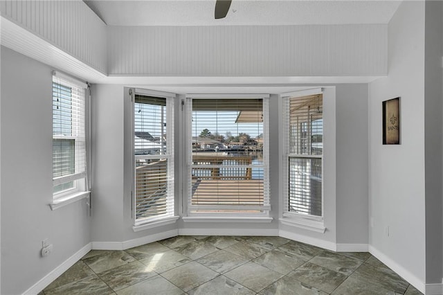 spare room featuring ceiling fan