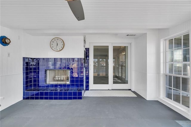 interior space featuring ceiling fan