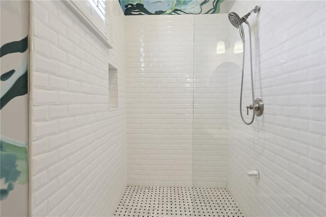 bathroom with a tile shower