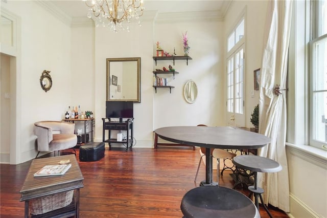 dining room with a notable chandelier, ornamental molding, and a wealth of natural light