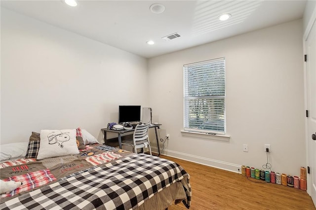 bedroom featuring wood-type flooring