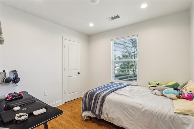 bedroom featuring hardwood / wood-style flooring