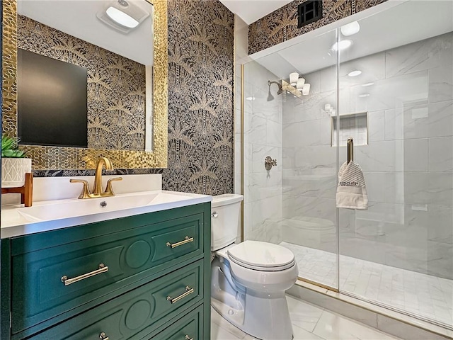 bathroom featuring vanity, an enclosed shower, and toilet