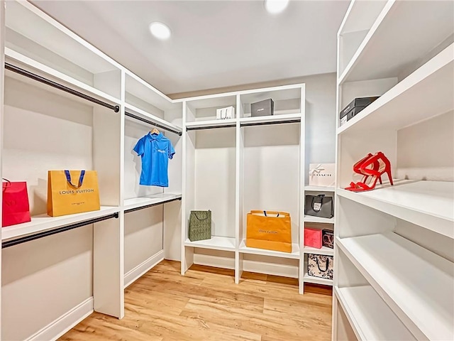 spacious closet featuring light wood-type flooring