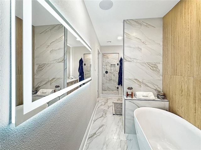 bathroom with separate shower and tub and tile walls