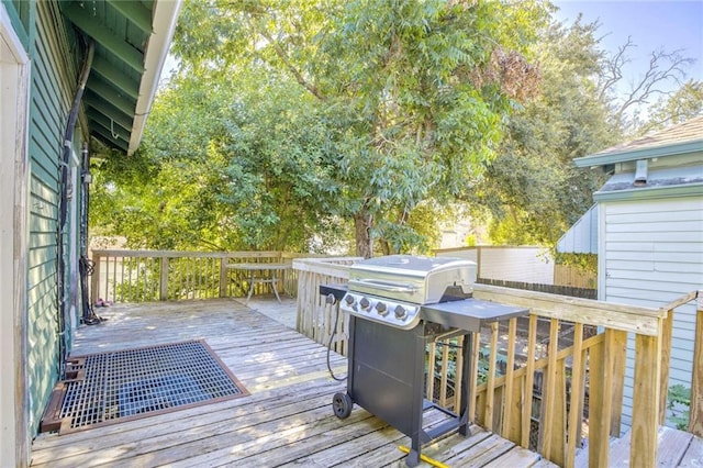 wooden deck featuring area for grilling