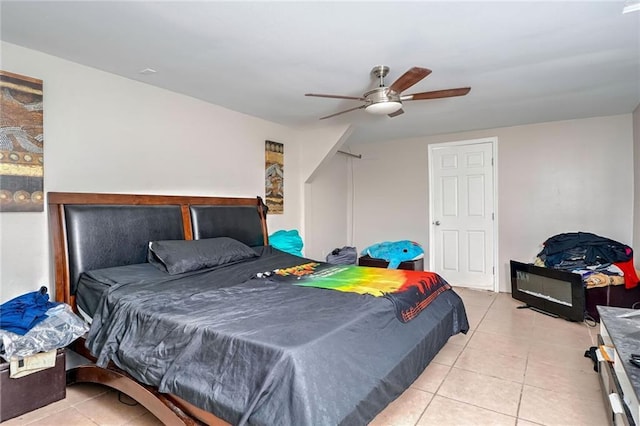 tiled bedroom with ceiling fan