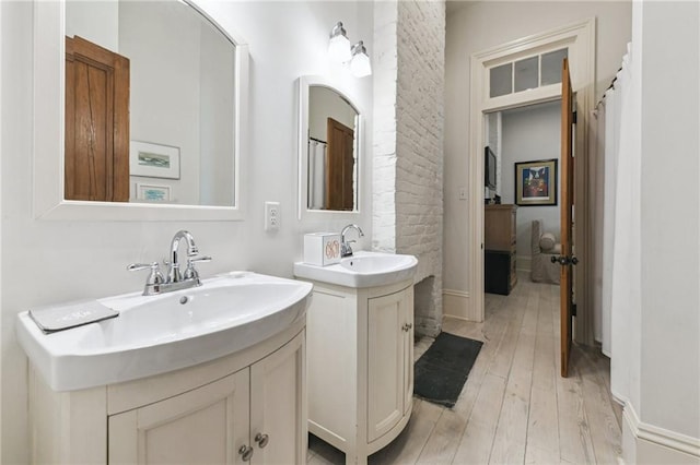 bathroom with wood-type flooring and vanity