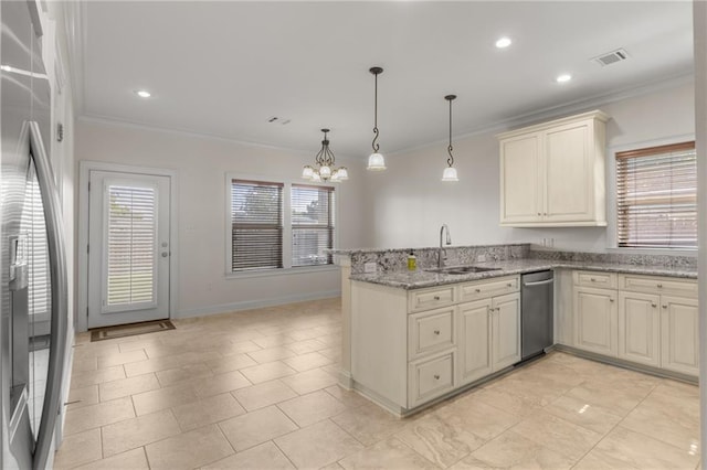 kitchen featuring sink, stainless steel fridge, light stone countertops, decorative light fixtures, and kitchen peninsula