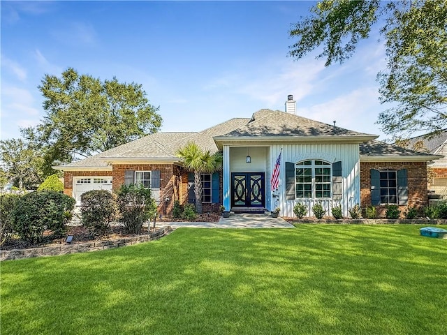 ranch-style house featuring a garage and a front yard